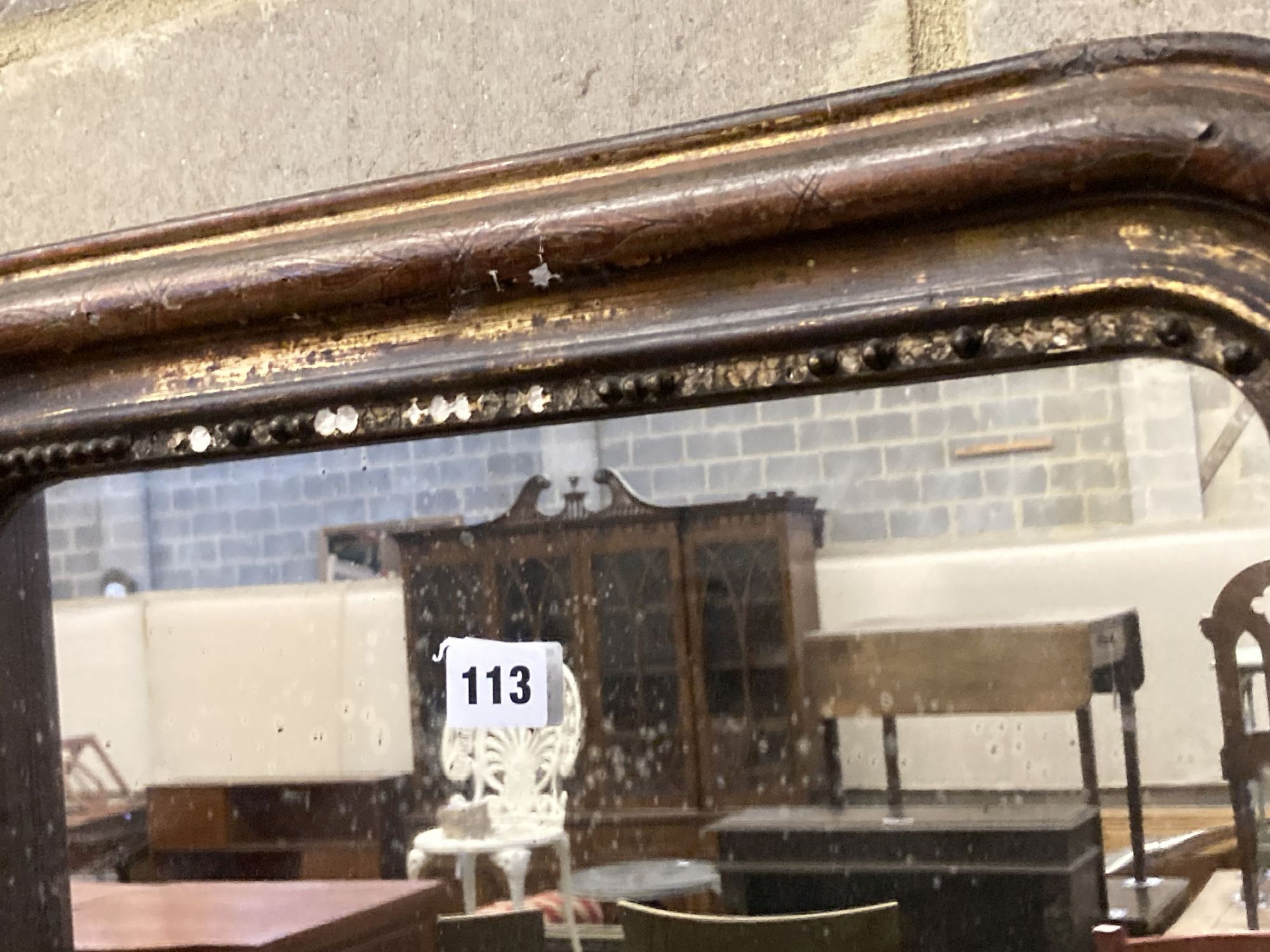 A 19th century French painted parcel gilt wall mirror, width 54cm, height 72cm